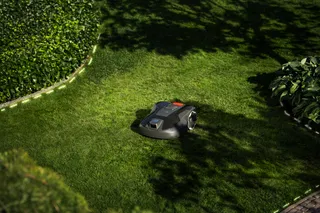 Husqvarna Automower Aspire R6V mowing in a garden
