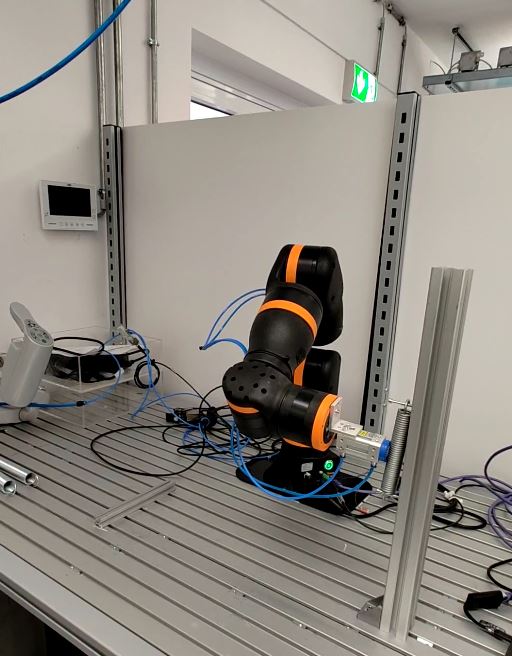 Automated clamping of a metal spring with igus ReBeL