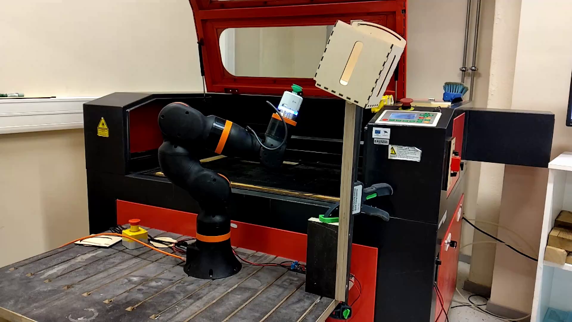 Automated loading and unloading of a laser engraving machine